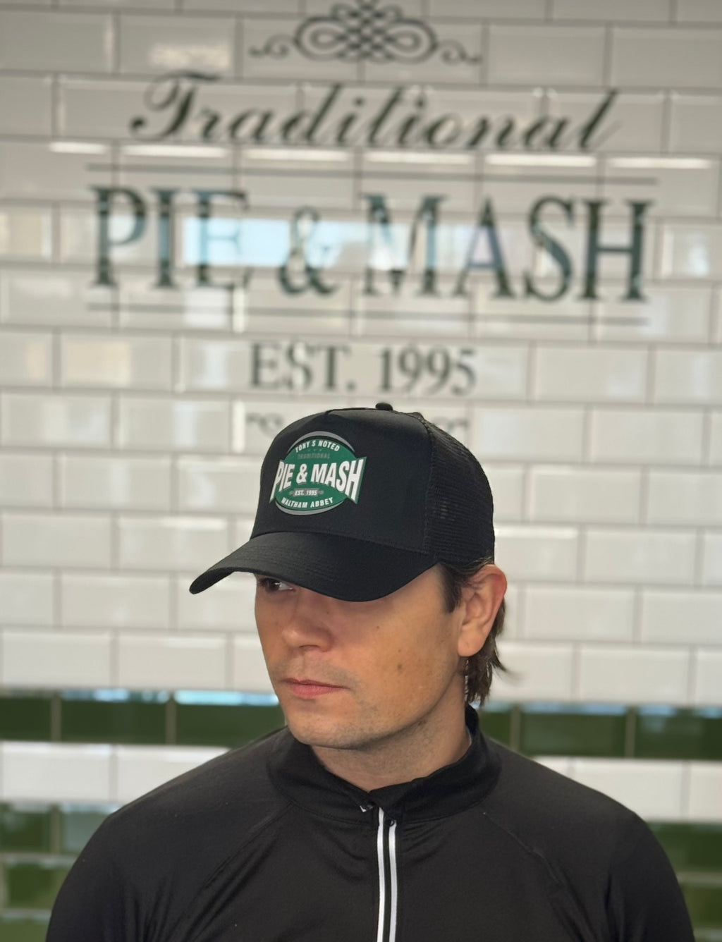 Black Trucker Style Hat With Logo